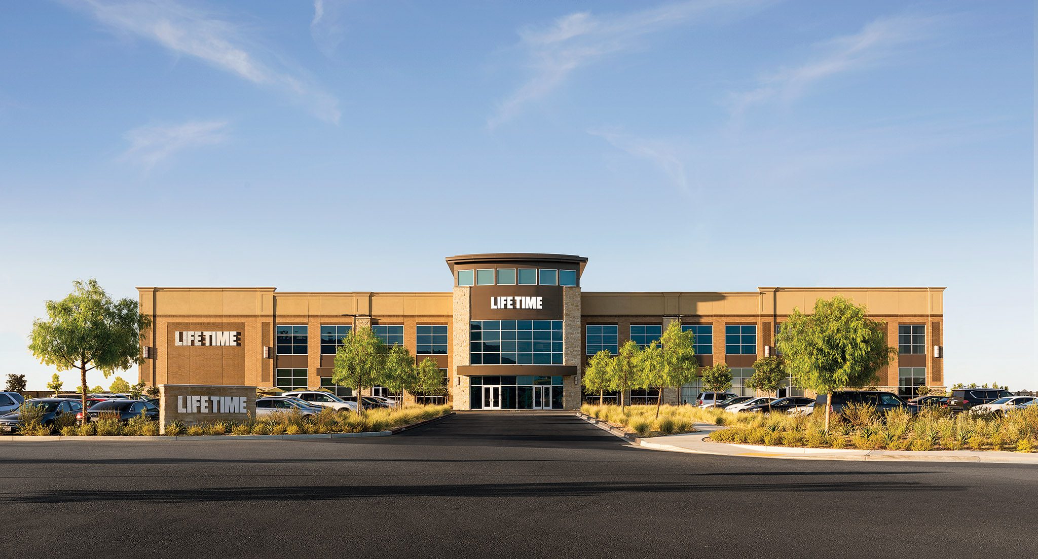 The exterior and parking lot of a Life Time Athletic Country Club