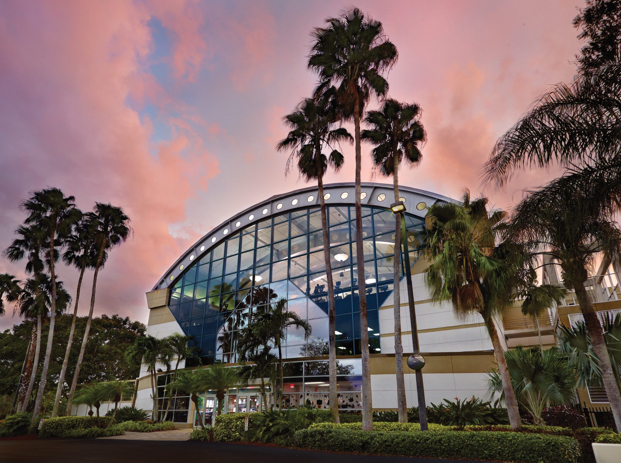 The exterior of Life Time Boca Raton with a pink and blue sky