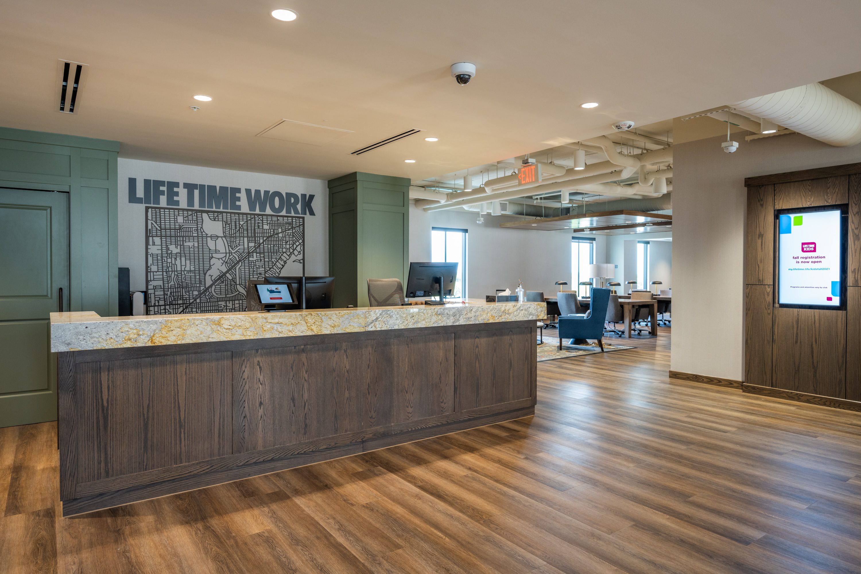 Reception desk and entry at Life Time Work Coral Gables