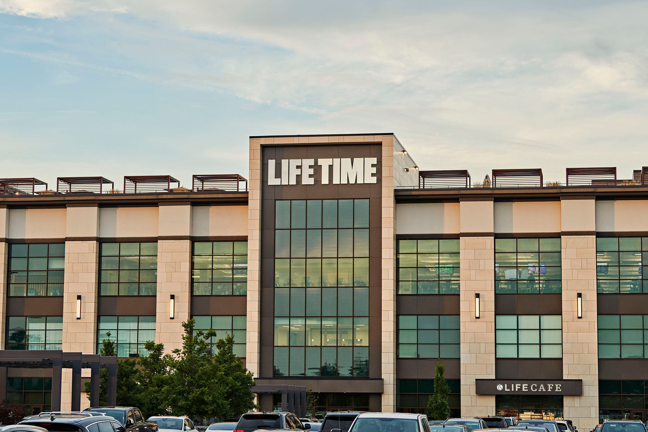 The exterior and front enterance of a Life Time location