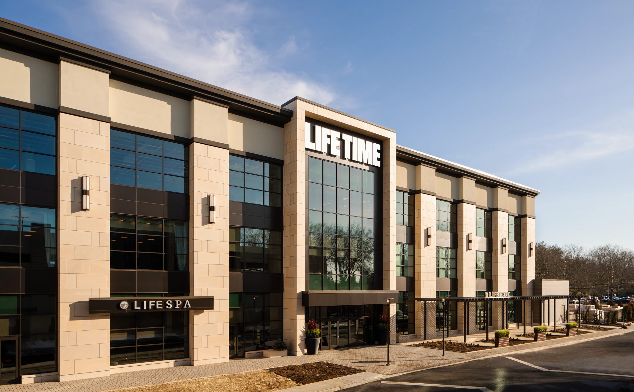 The exterior and front enterance of a Life Time location