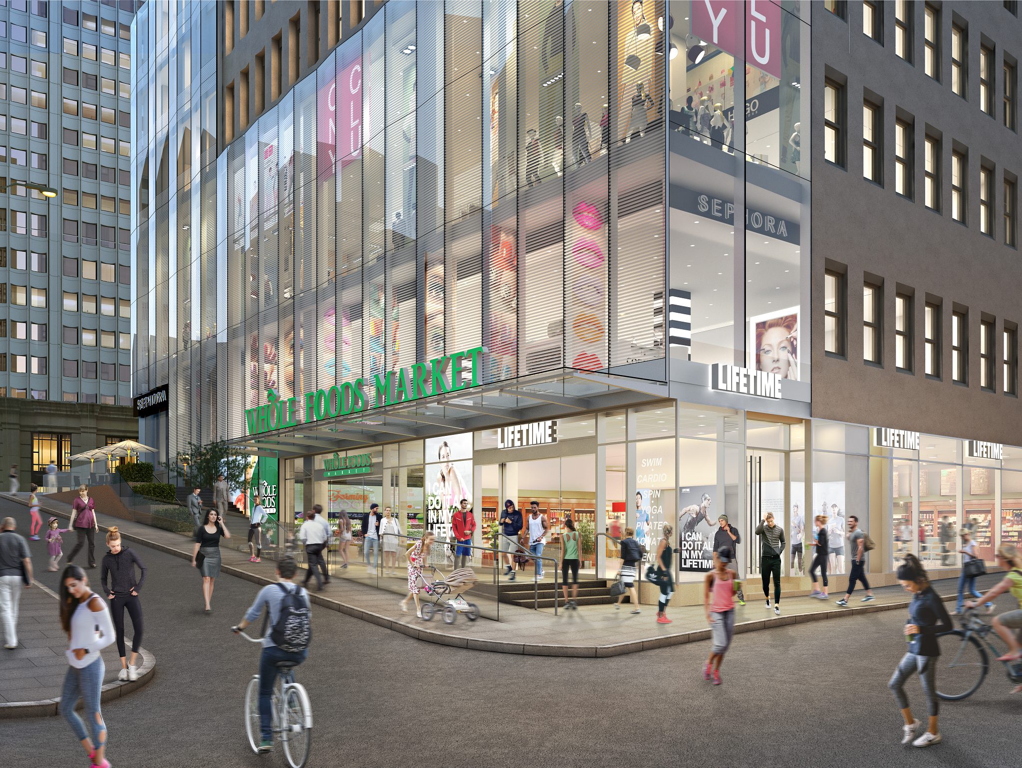People walk and bike on a busy street outside the Life Time One Wall Street New York location