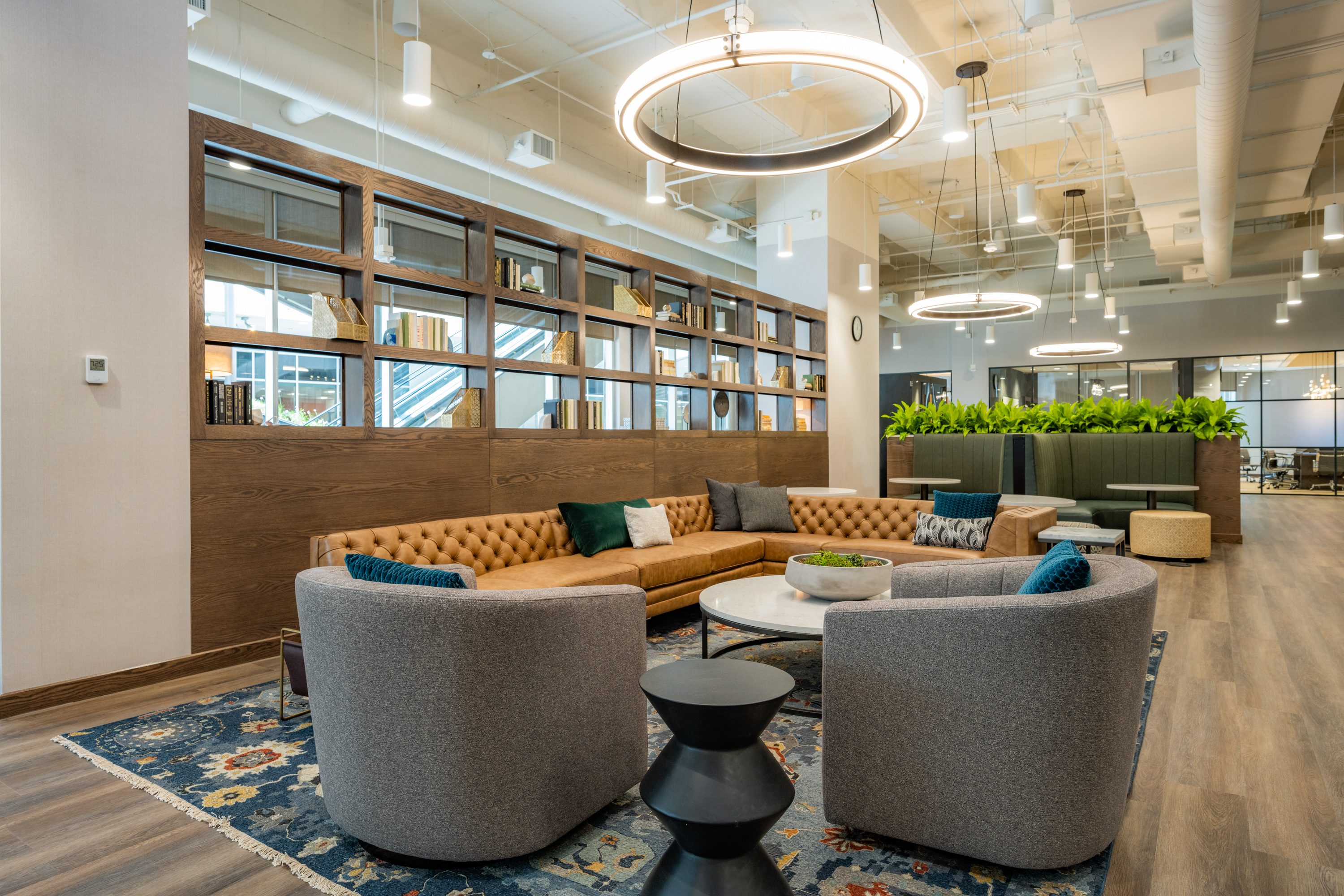 Open seating area with couches and chair seating at Life Time Work