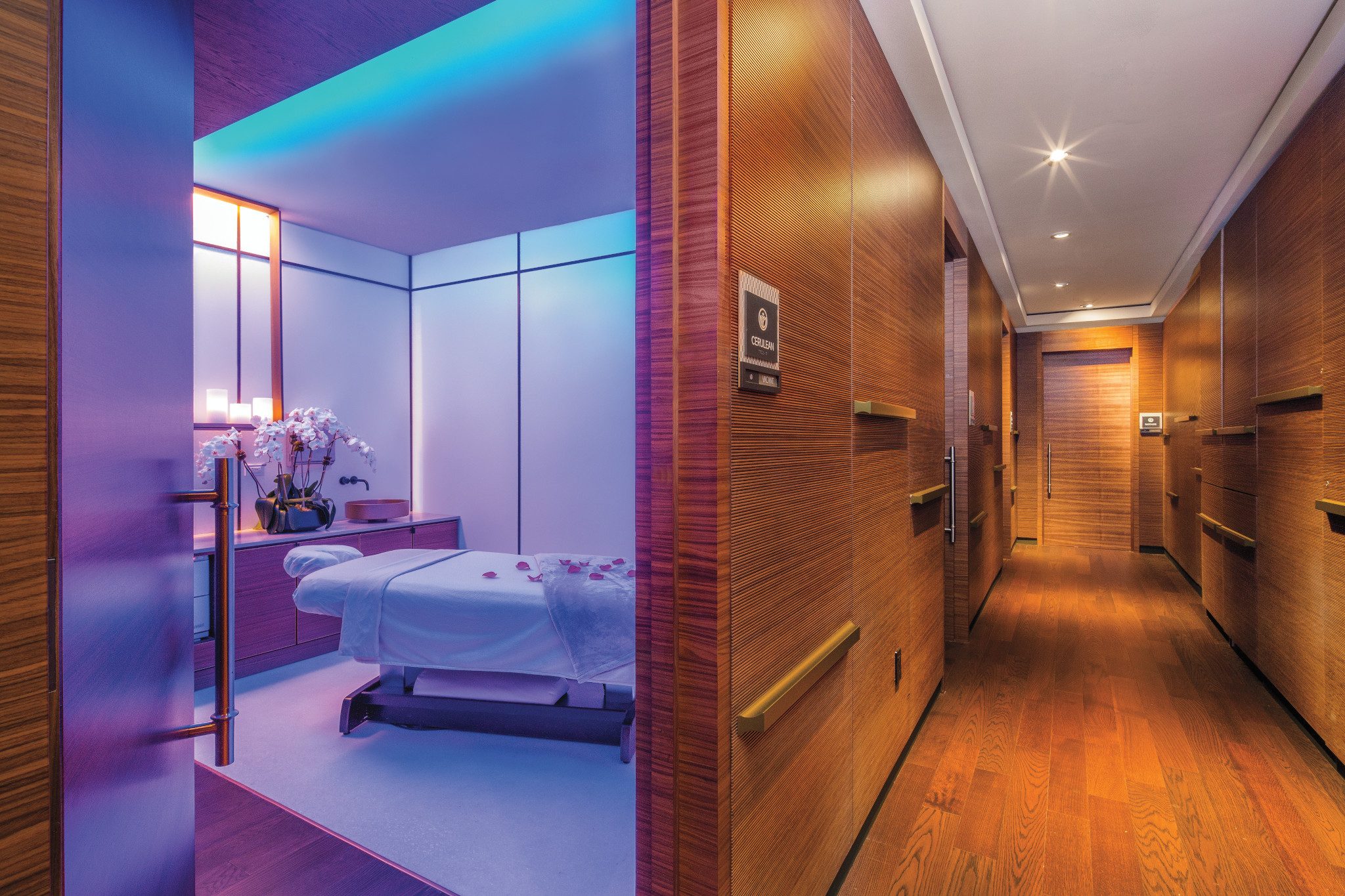 Hallway leading to an open massage room at the Life Time Sky club location