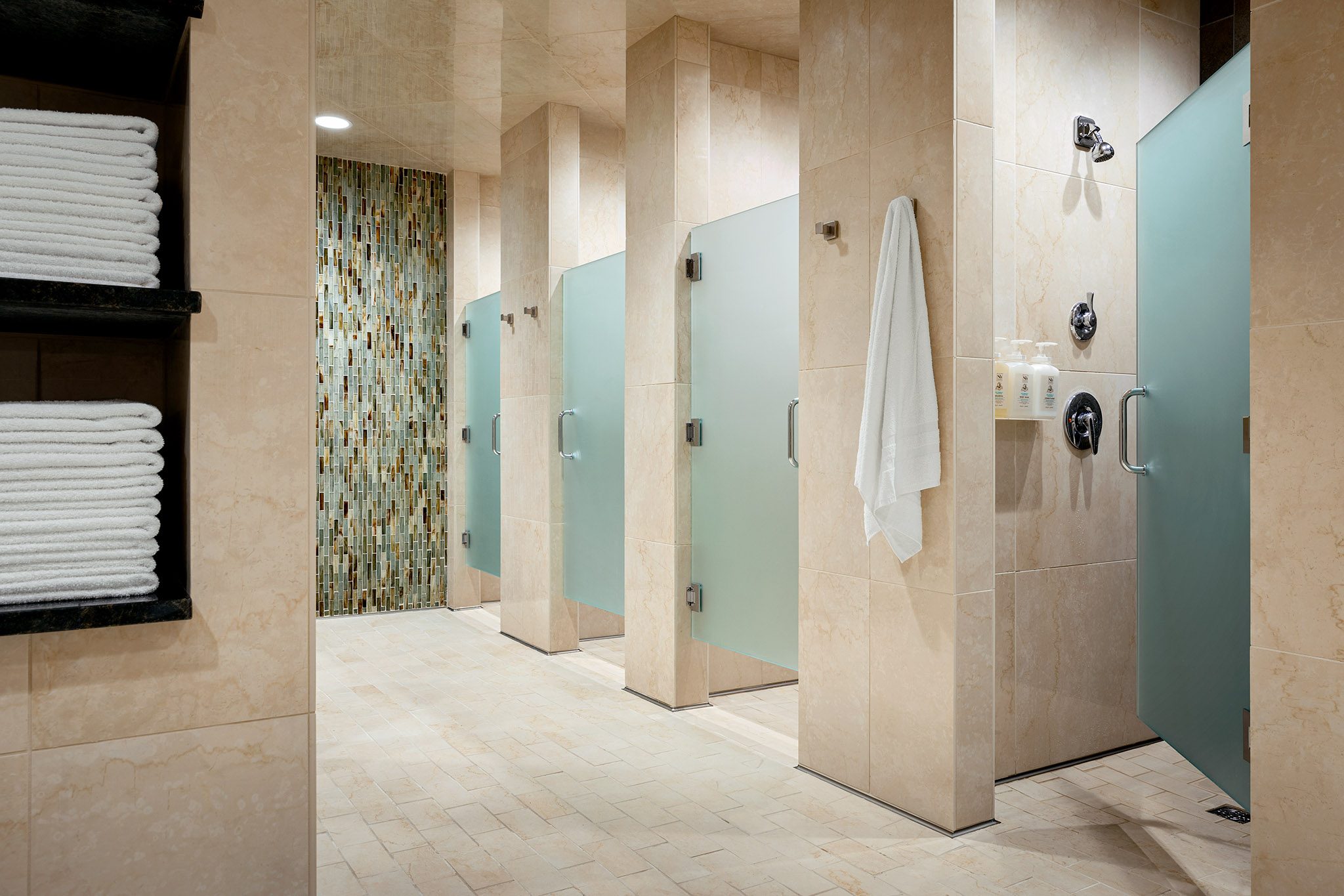 Shower stalls inside a locker room at Life Time