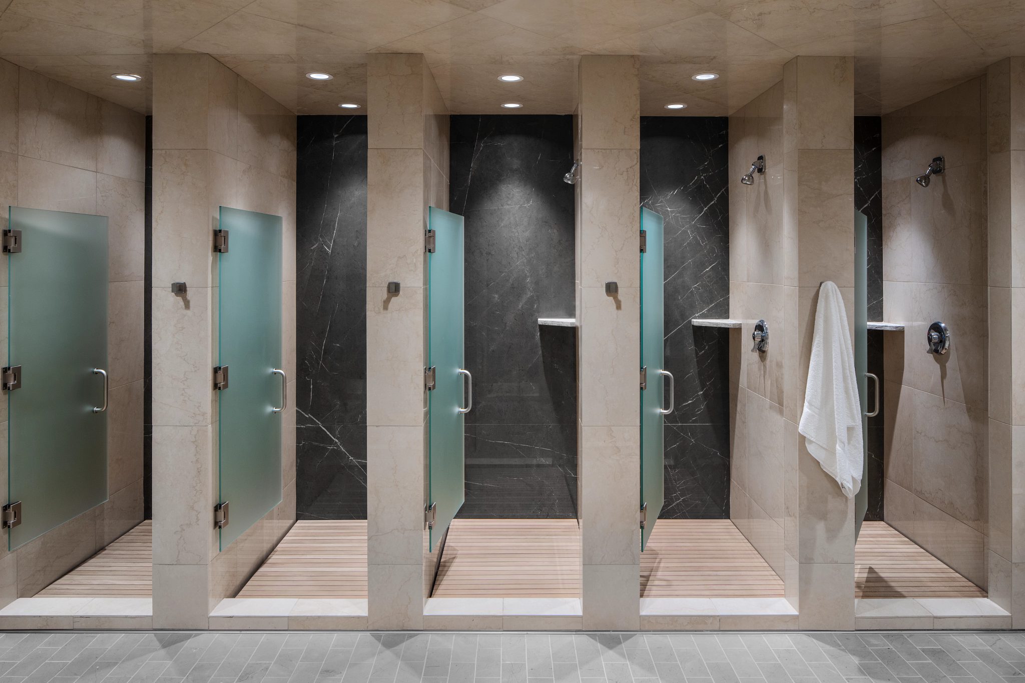 Open shower stalls at Life Time