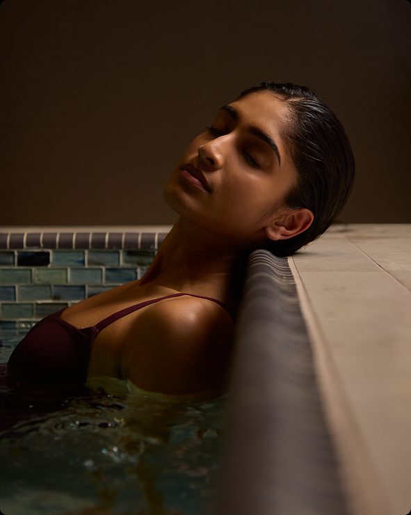 a woman relaxing in a whirlpool at Life Time