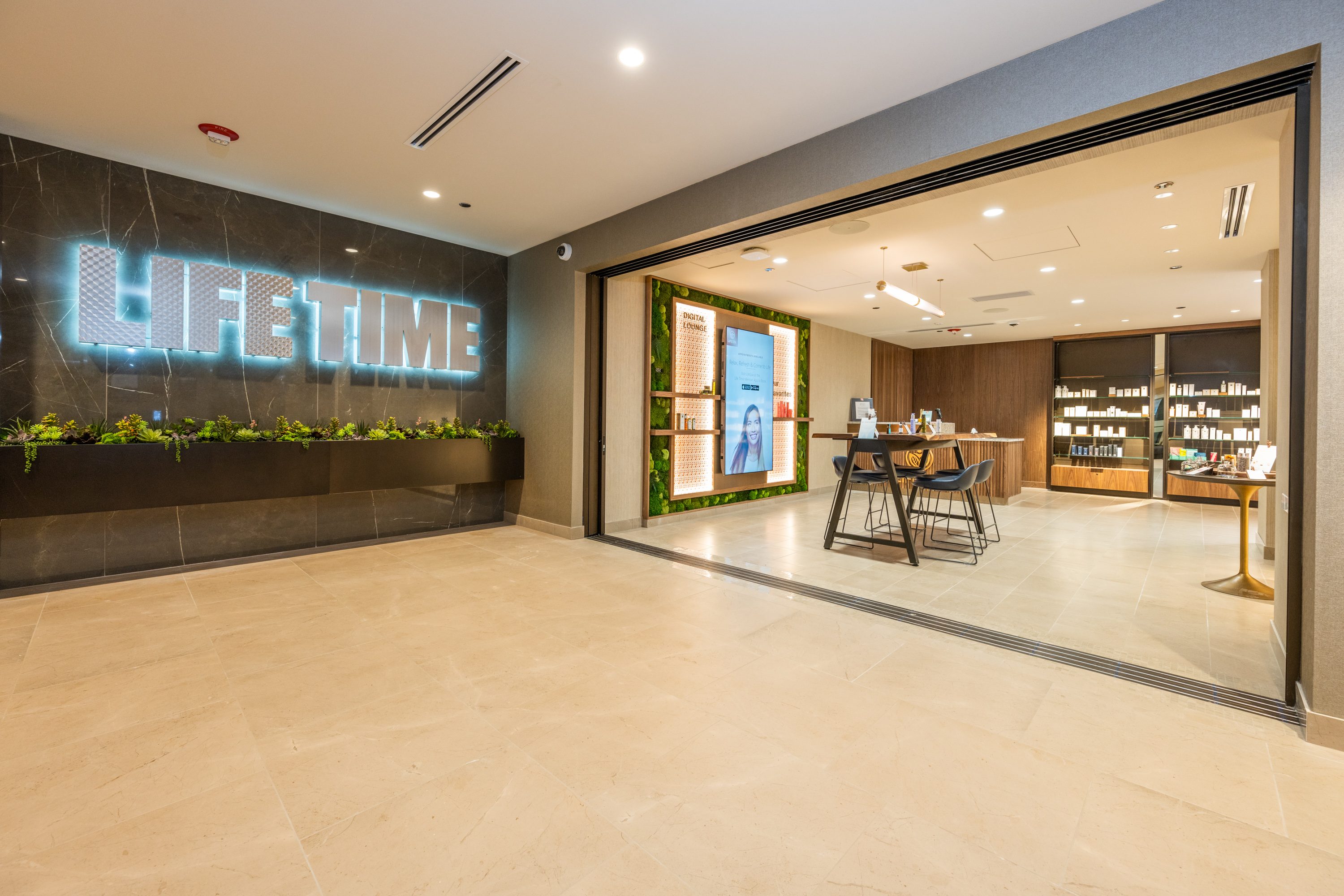 The entryway of the Lifespa, with tables and chairs, and products for sale