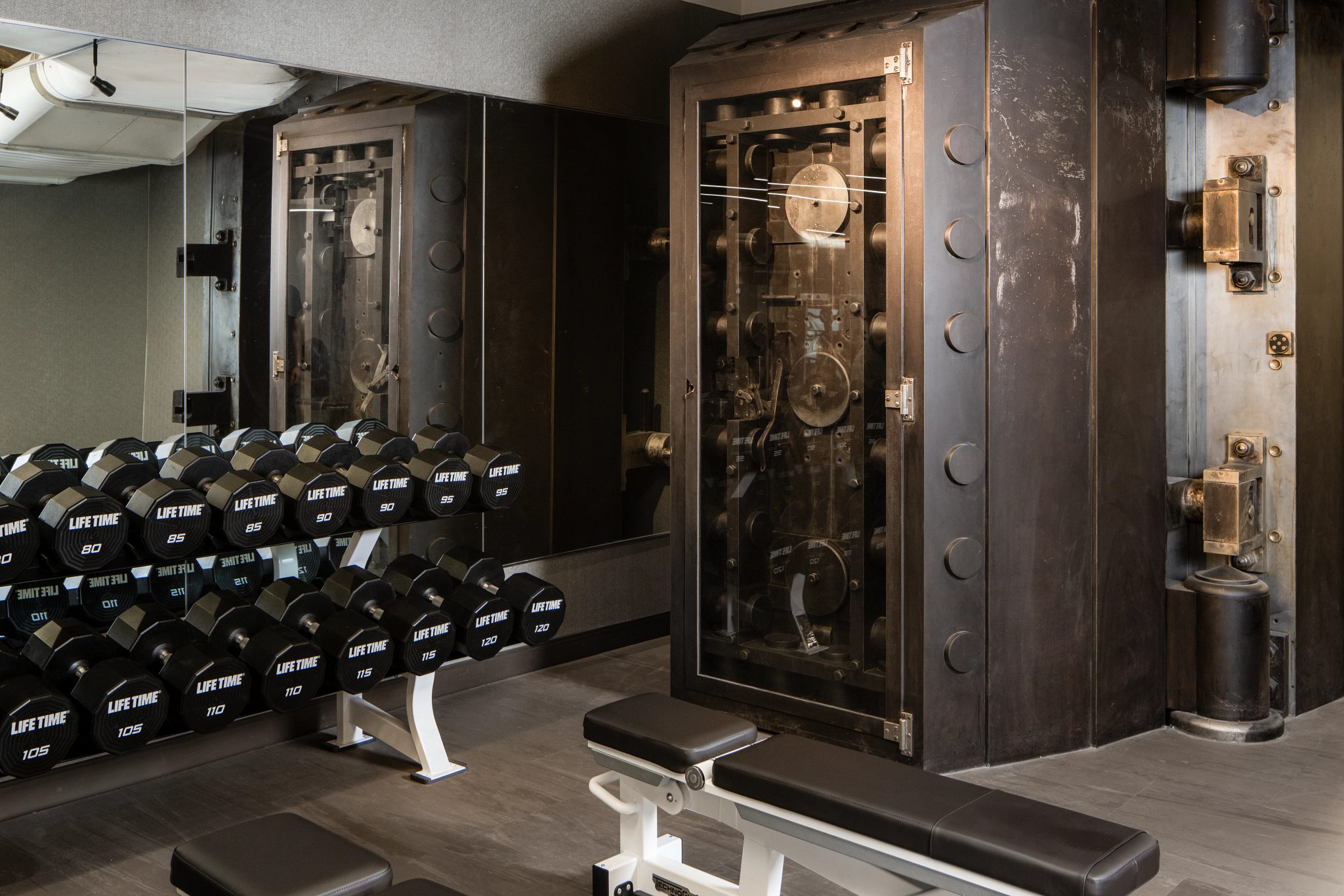 A large steel mechanical safe on the fitness floor at One Wall Life Time club location