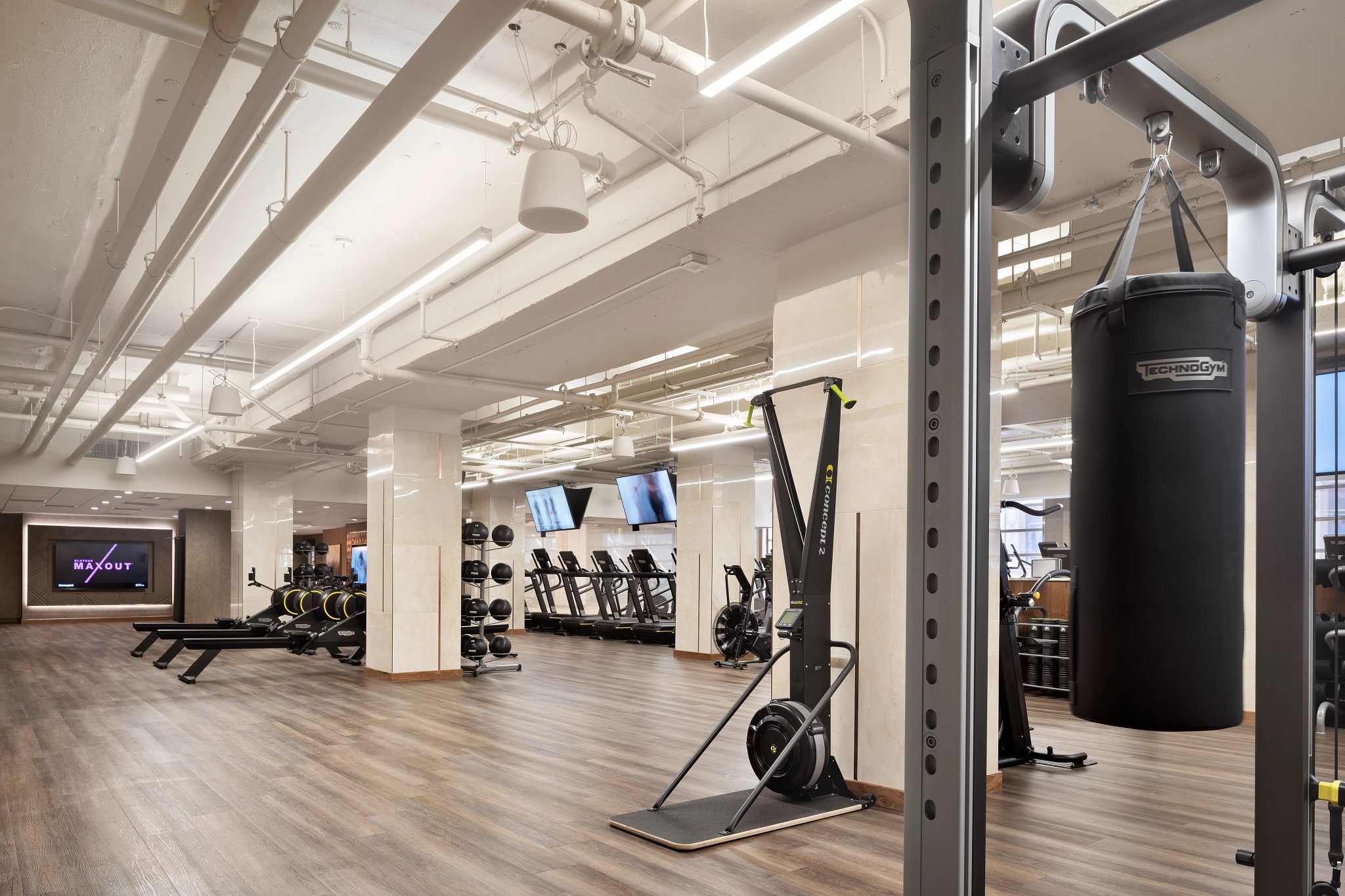 Fitness floor filled with various strength and cardio machines