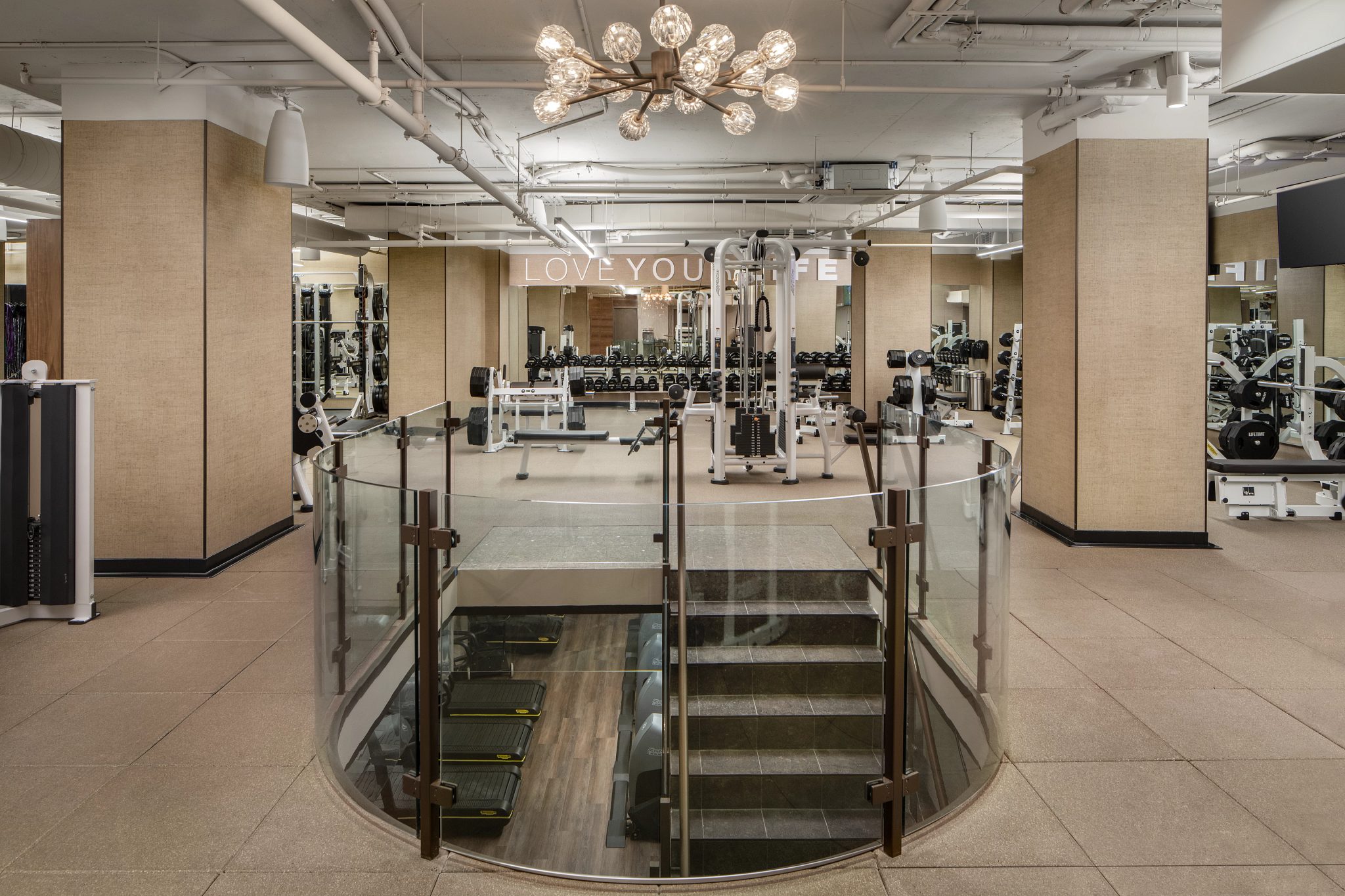 Strength machines on a fitness floor at Life Time