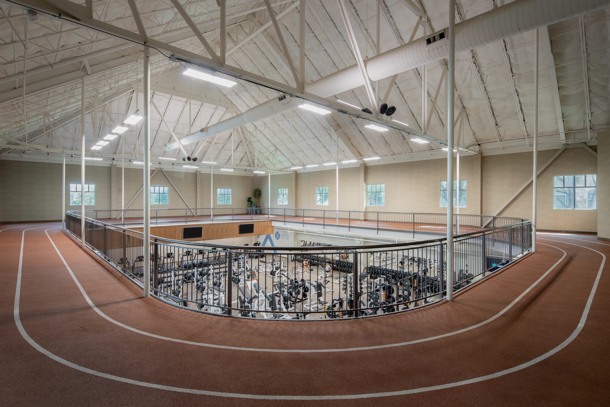 Indoor running track above the fitness floor at Life Time