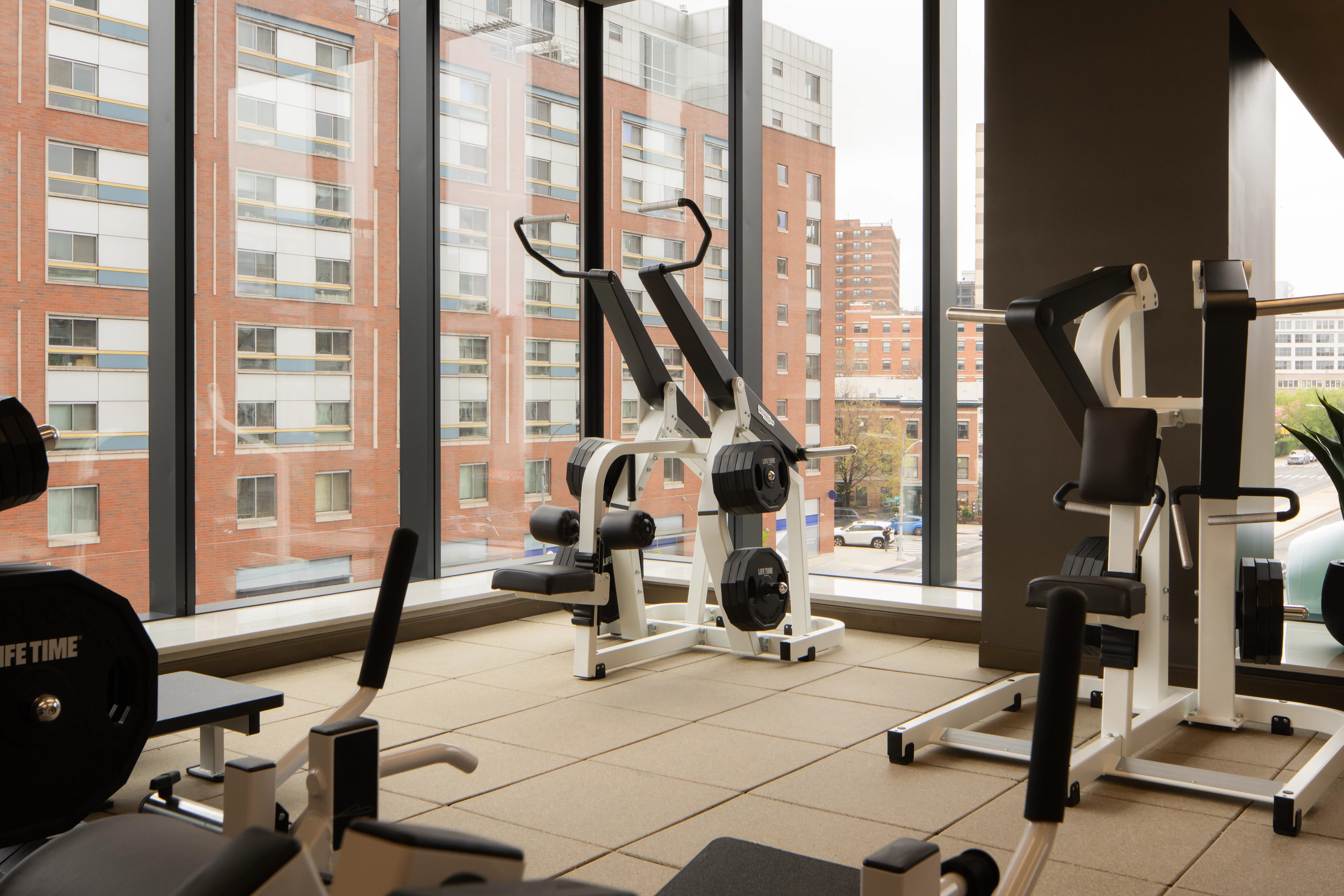 Strength training equipment on the fitness floor at the Life Time Atlantic Avenue club location
