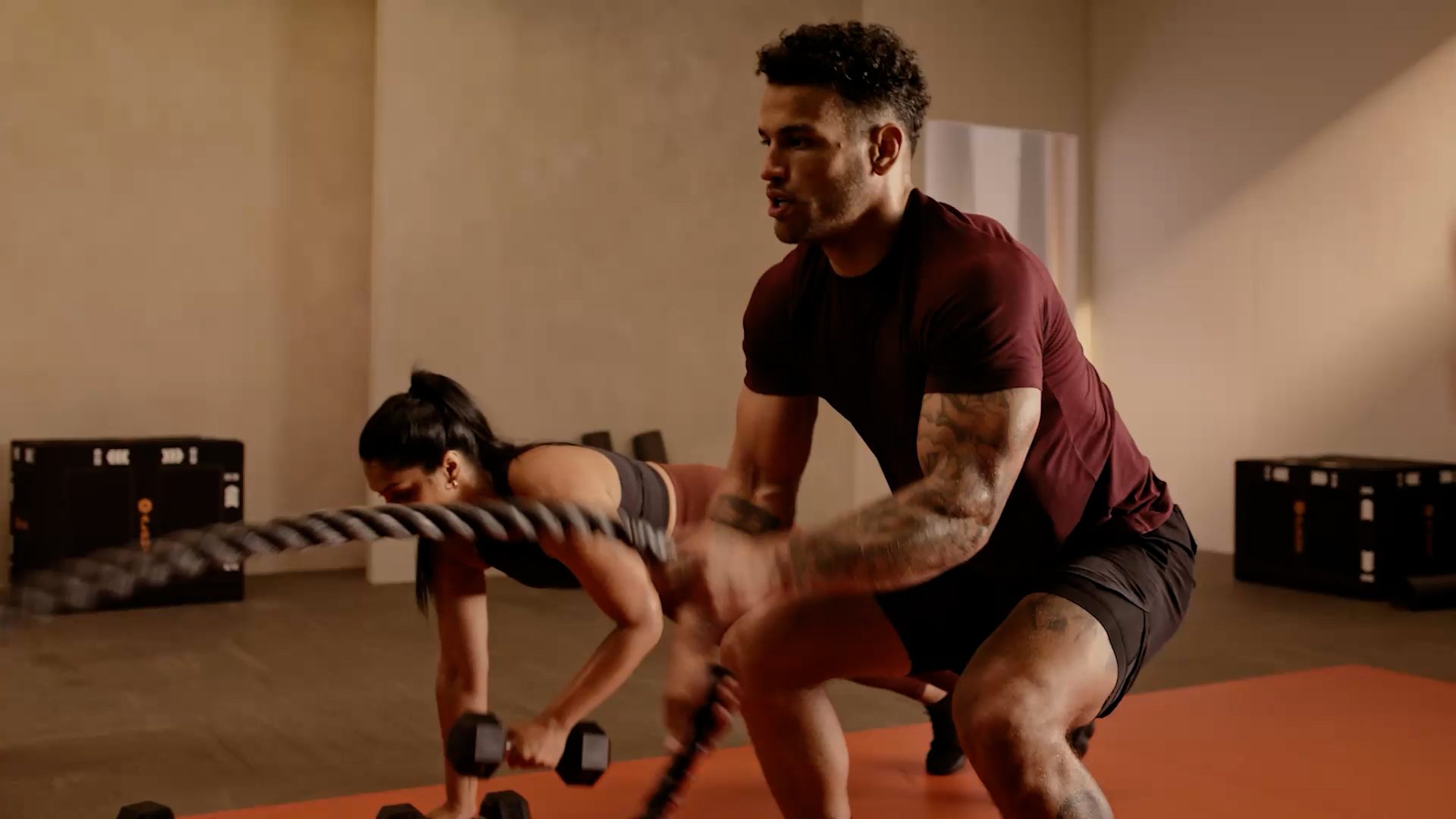 man working out with ropes