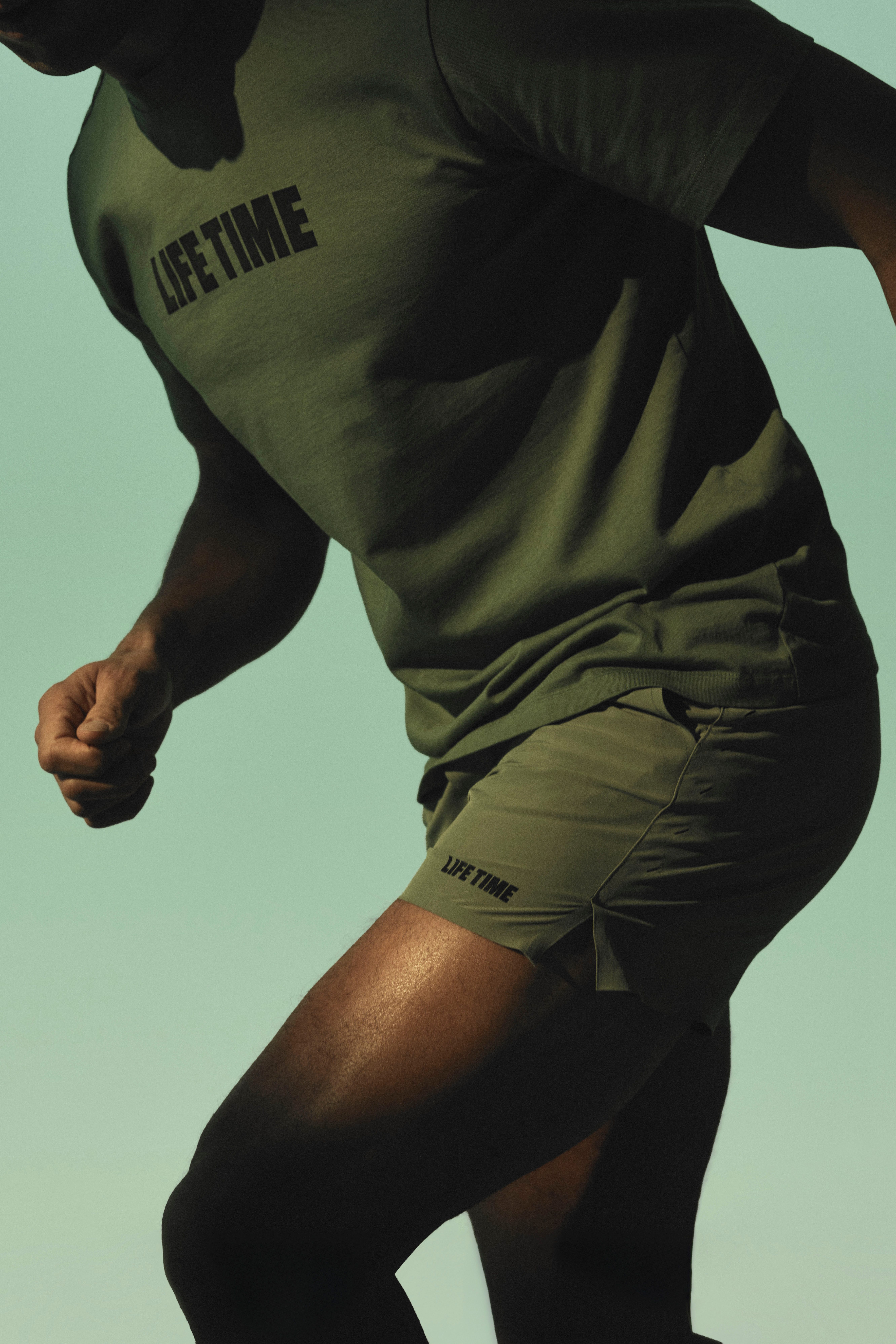 man in green lif time t-shirt