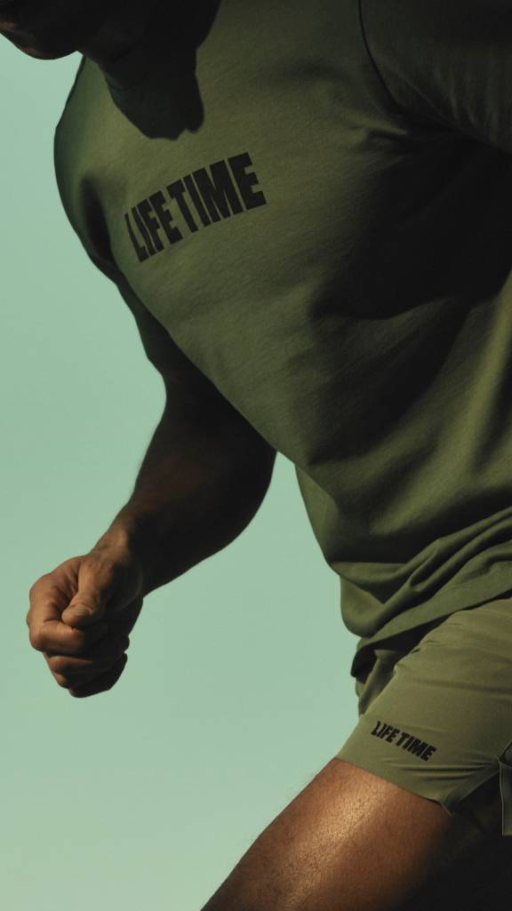 man in green lif time t-shirt