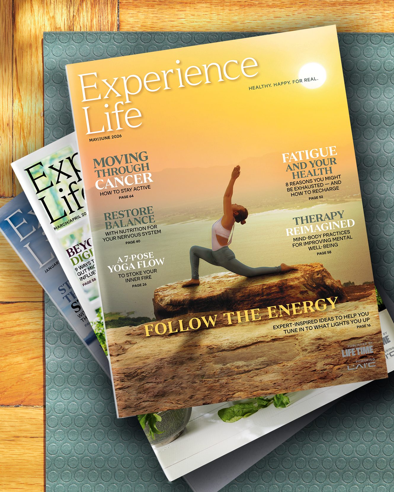 three experience life magazines on a table