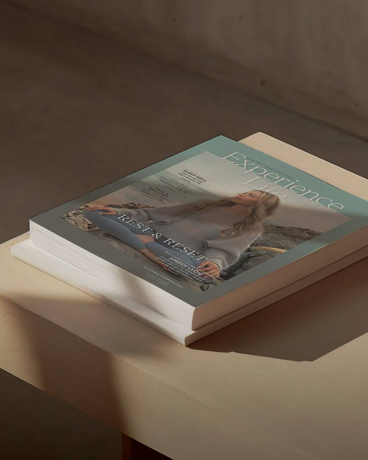 experience life magazine sitting on a table