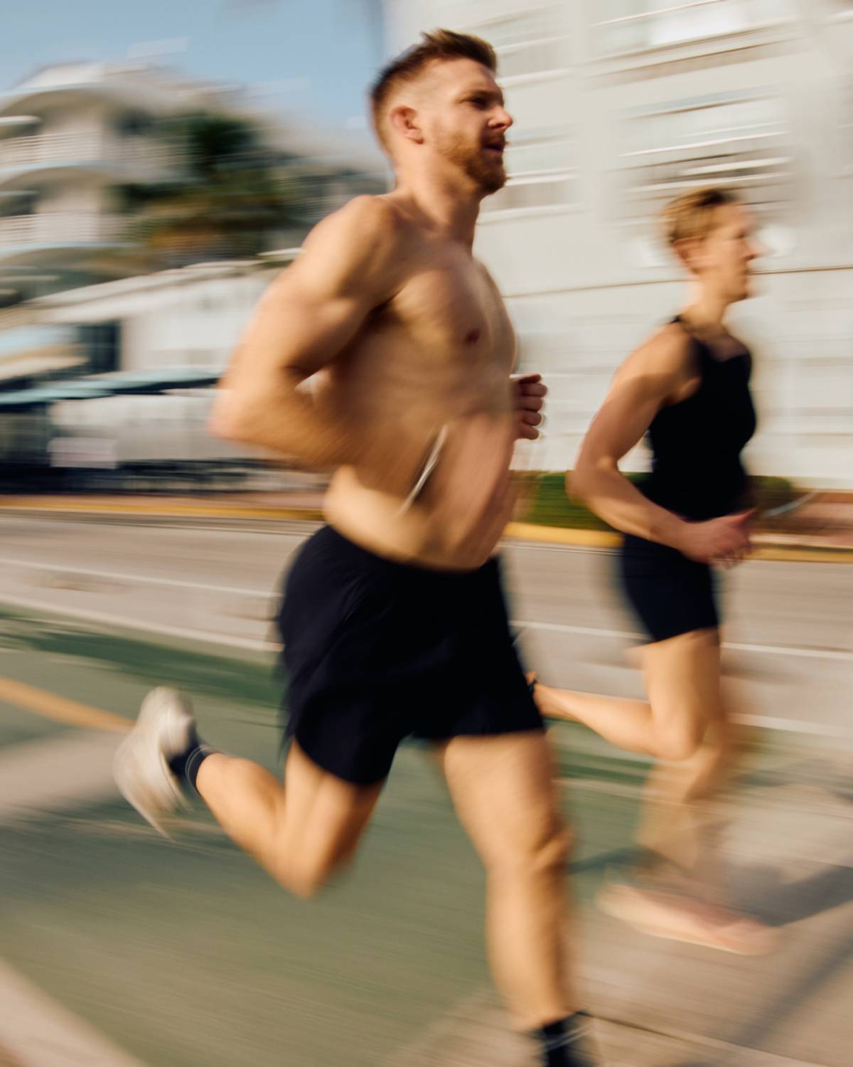 a man and awoman running in a race