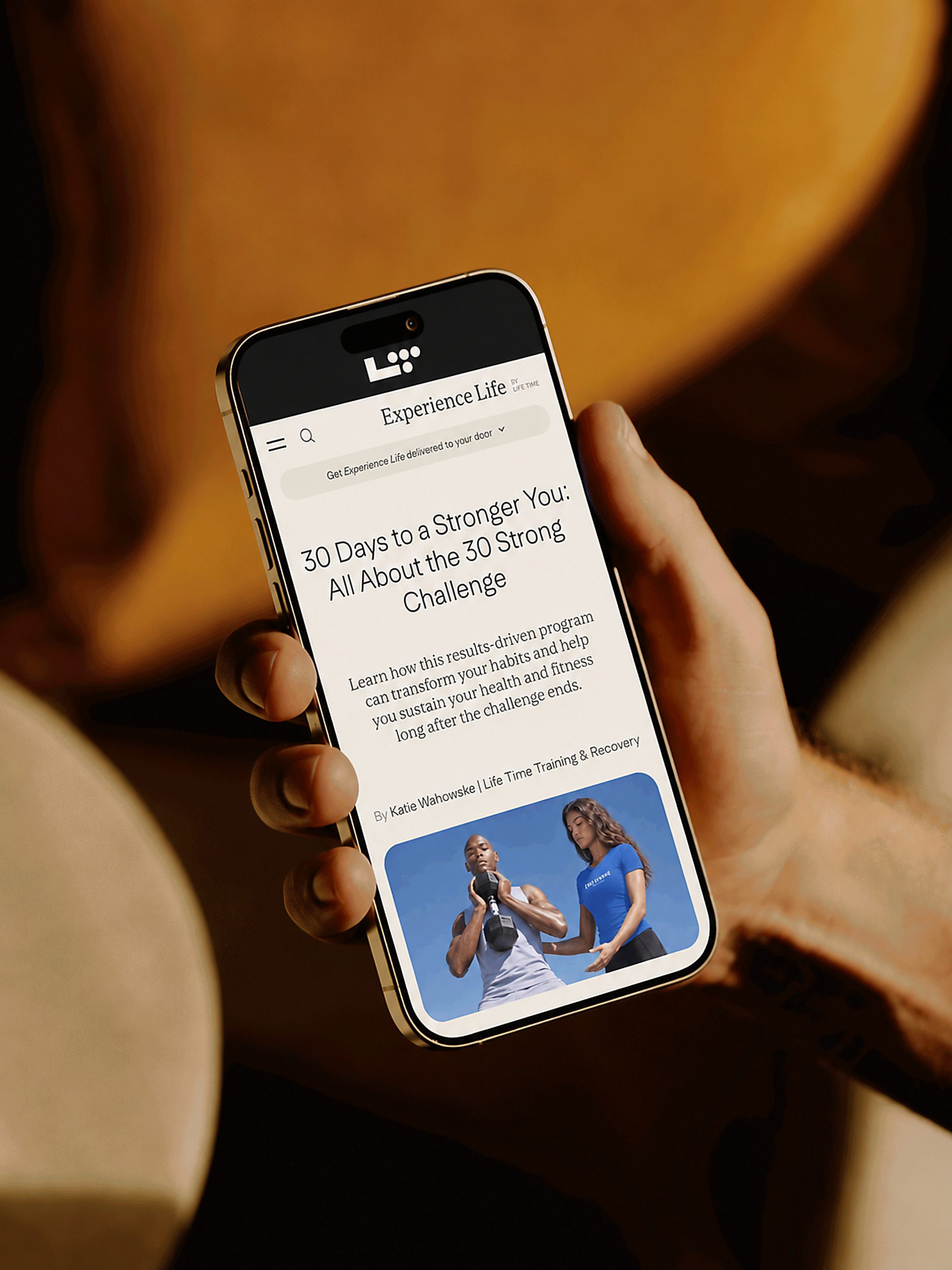 hand holding phone with 30 strong article showing