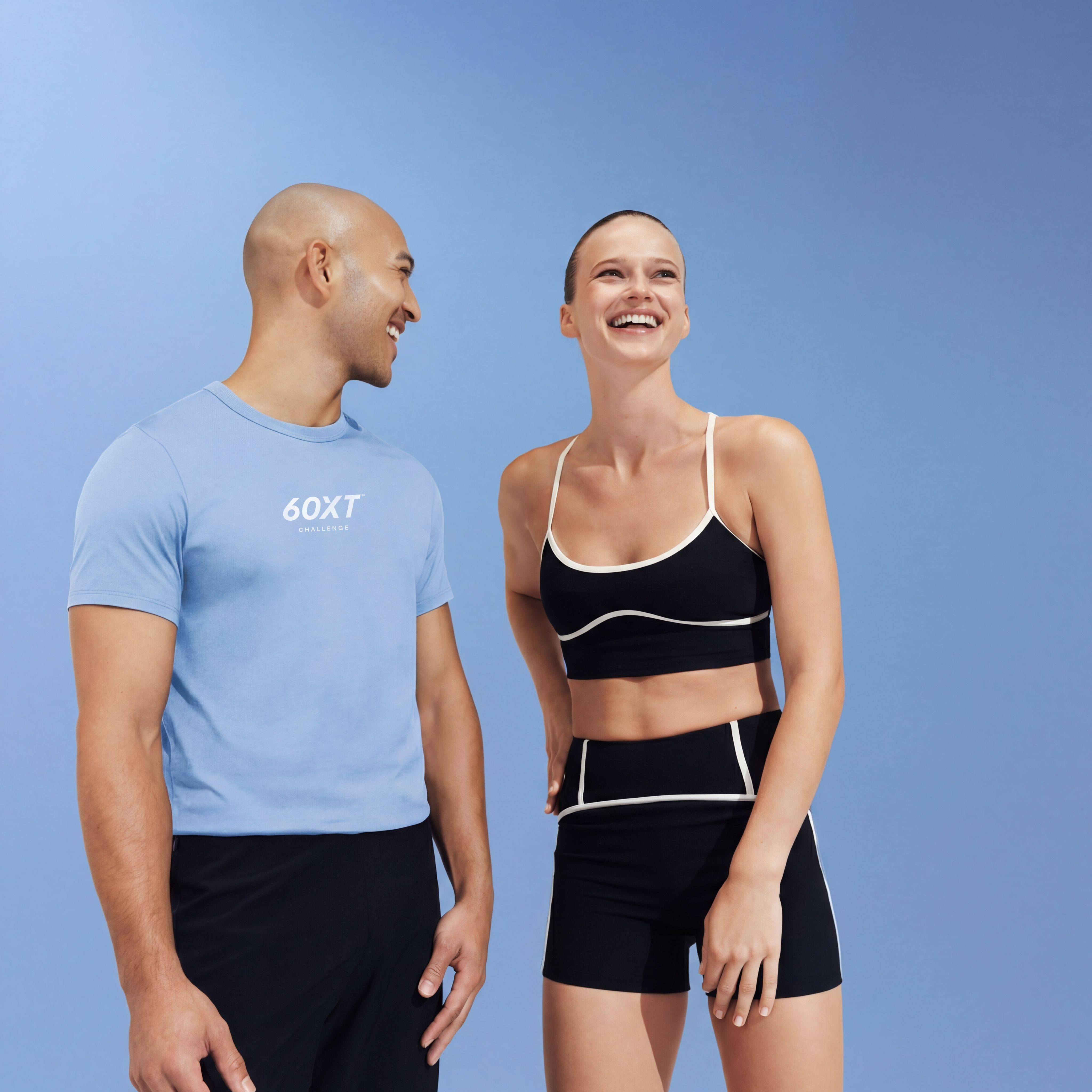 man and woman standing together laughing