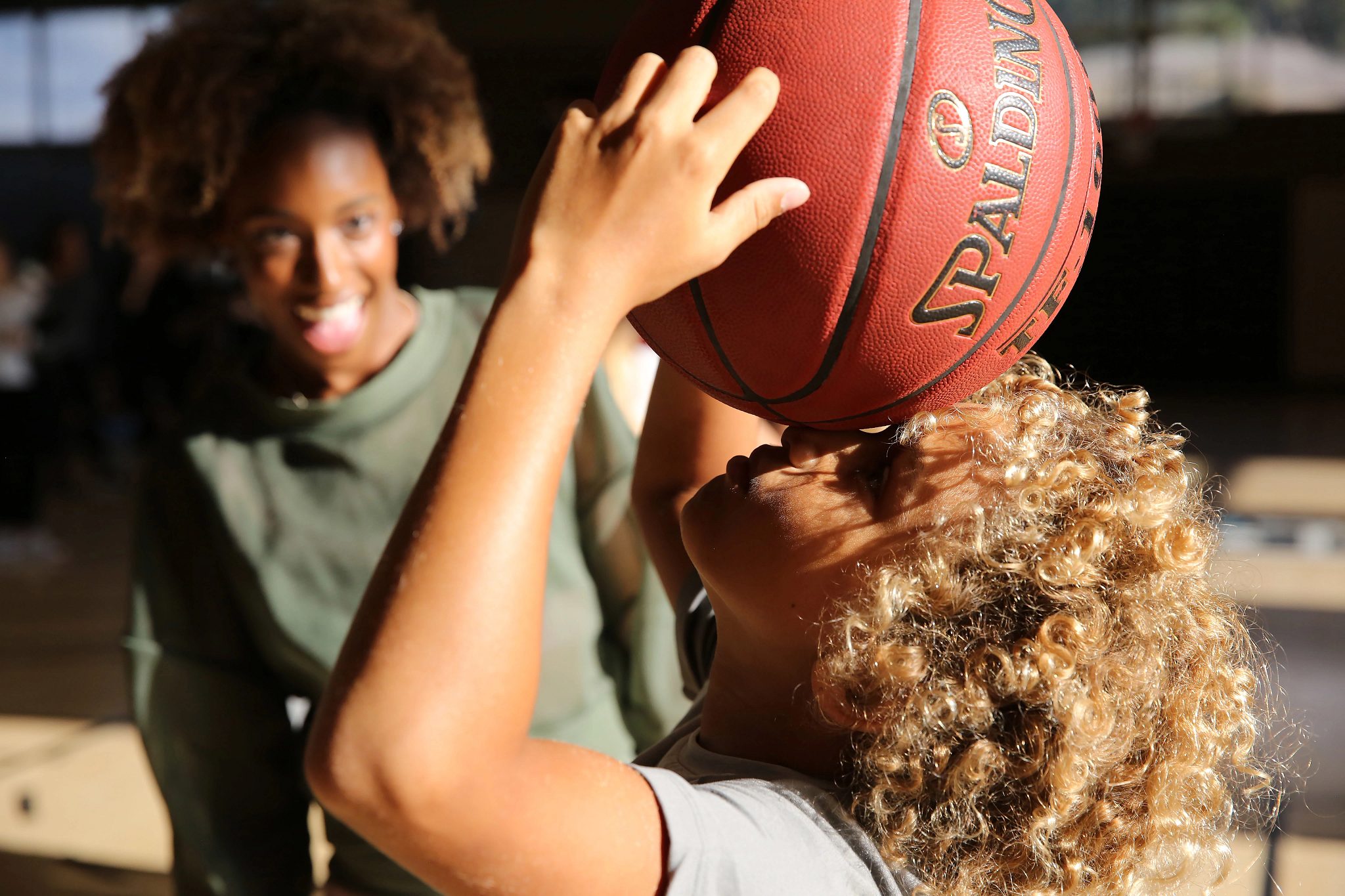 a child holding a basketball