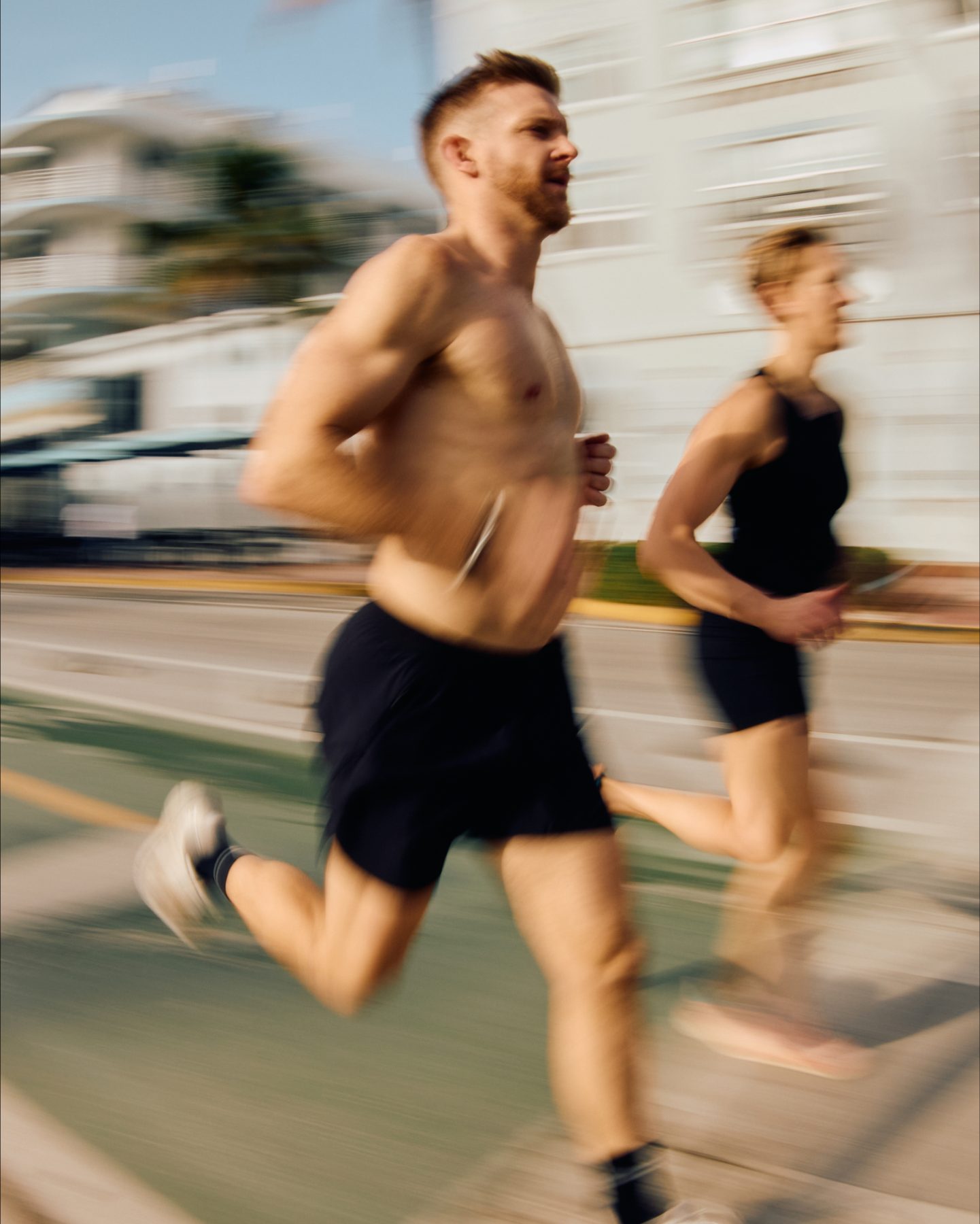 two people running next to each other at a marathon race