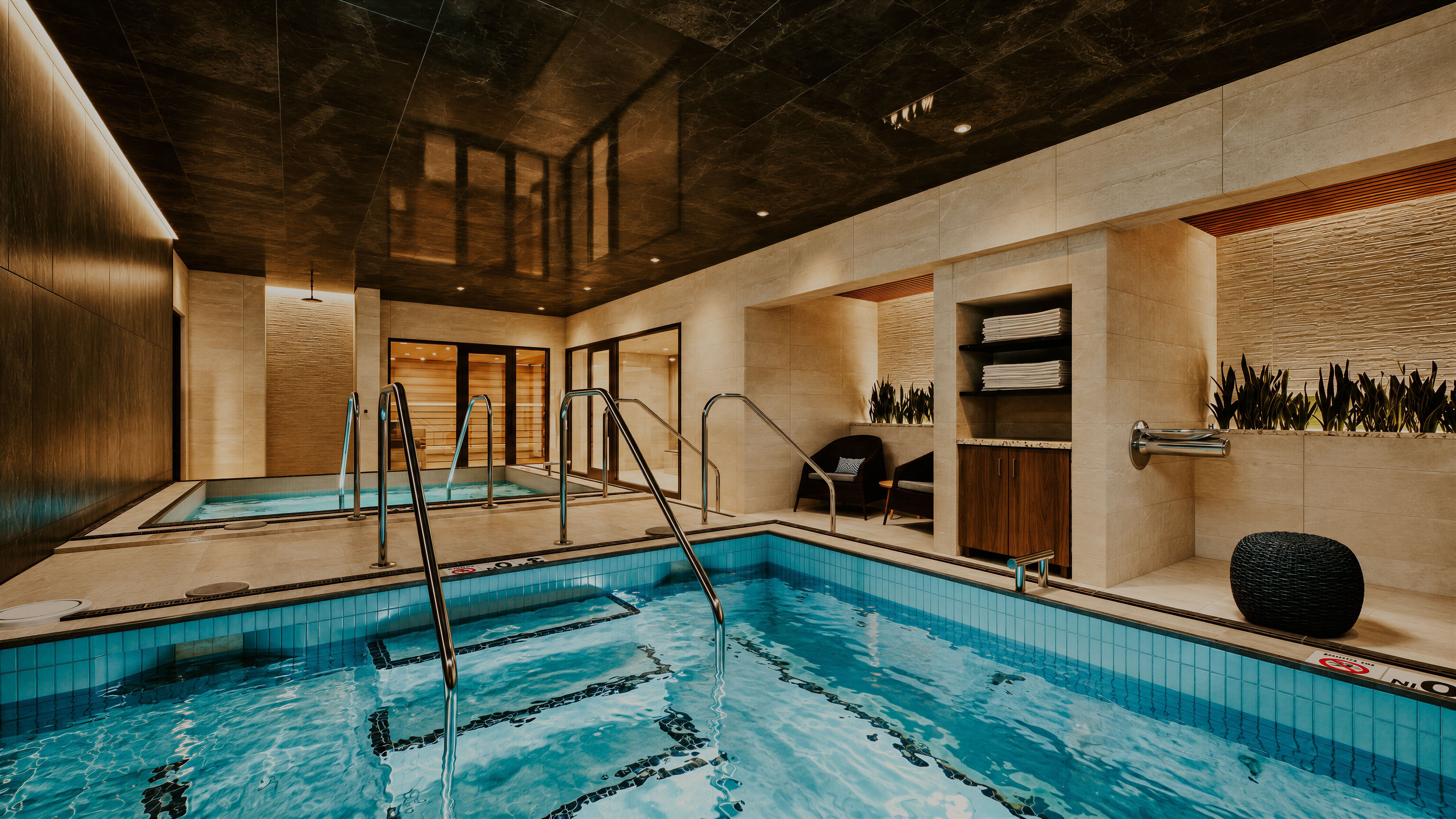 A moody hydrotherapy suite; whirlpool, cold plunge, steam and sauna in the Naperville Life Time club.