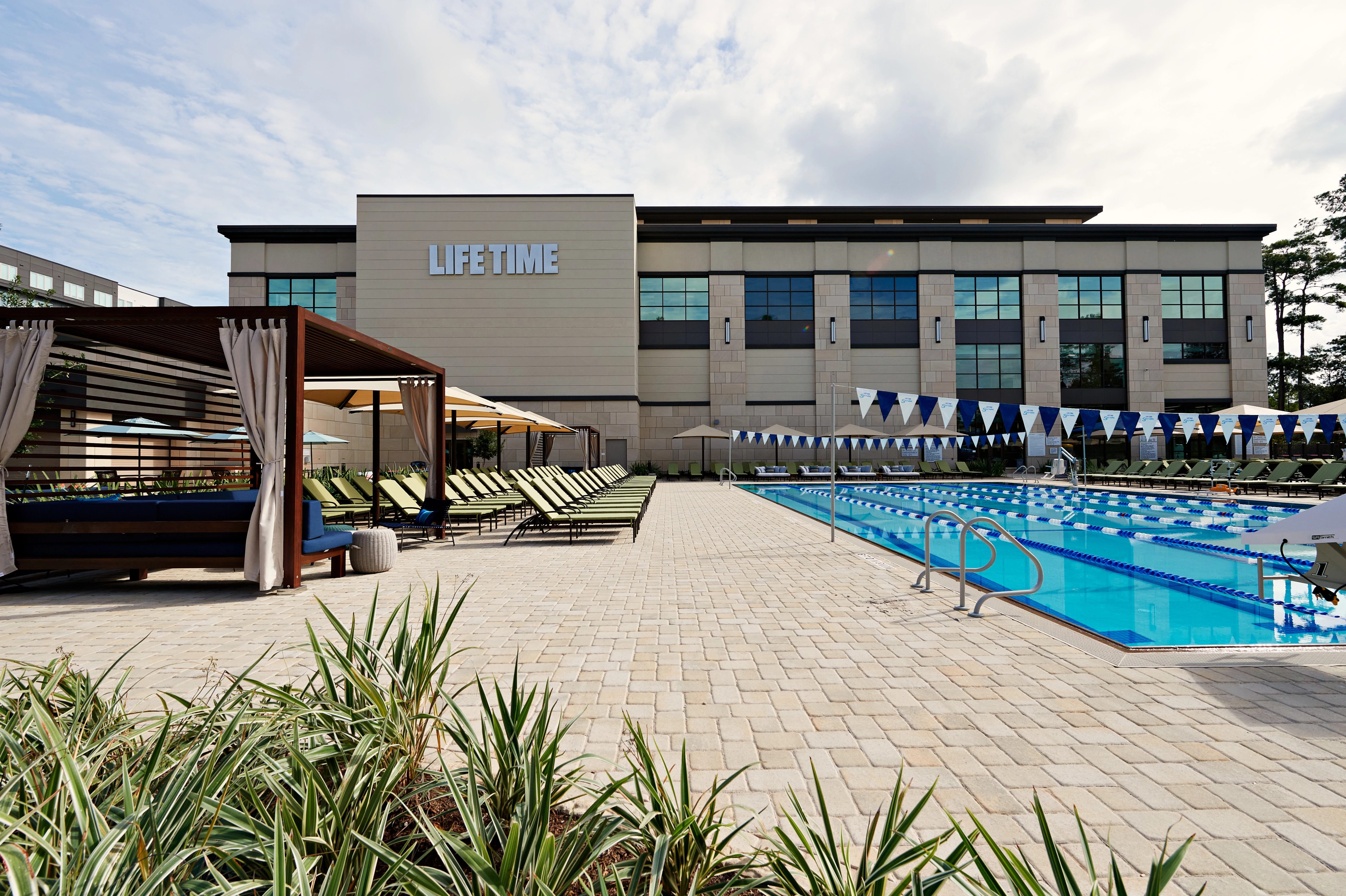 Outdoor lap pool and exterior of the Life Time Durango club location