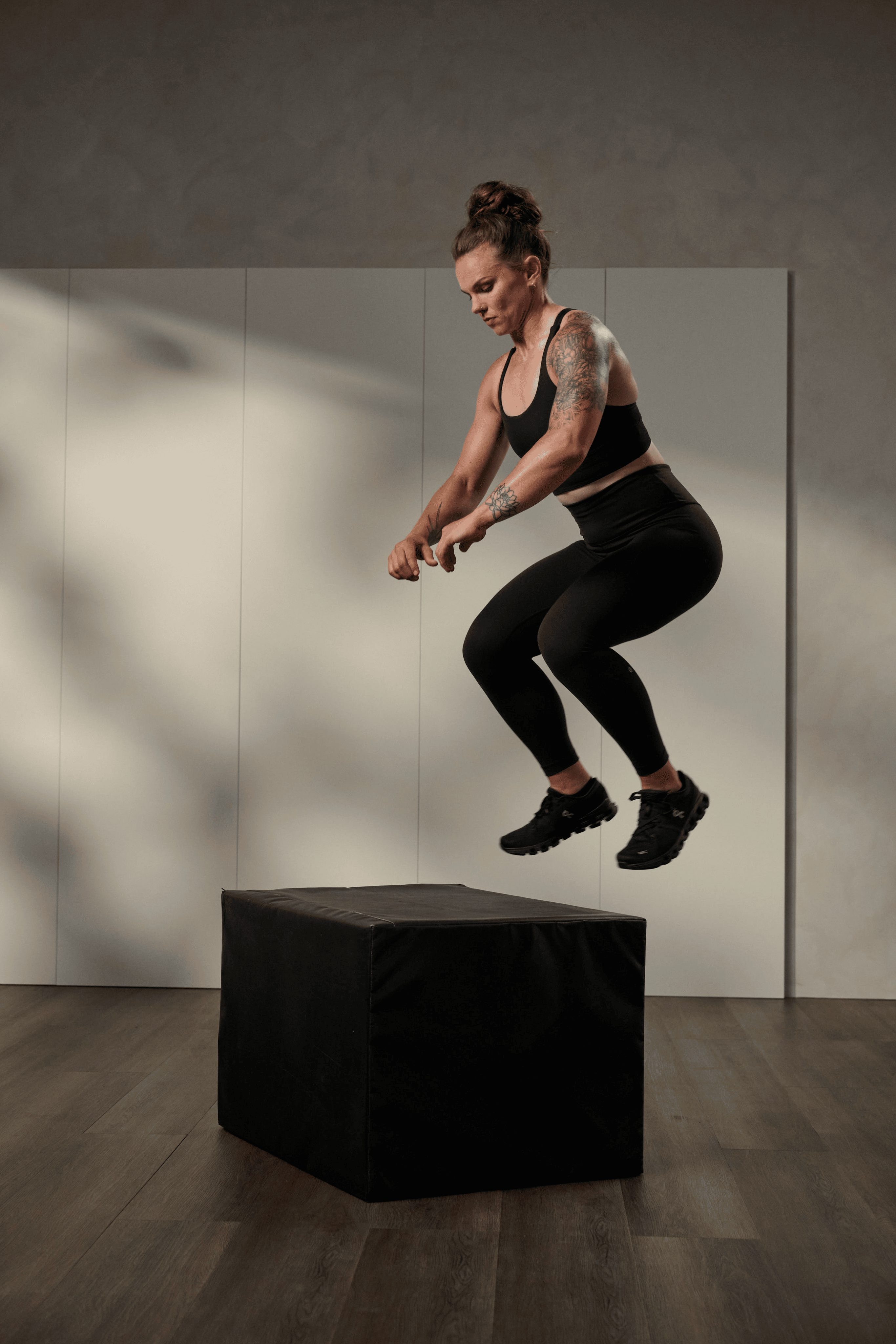 A woman performing a box jump