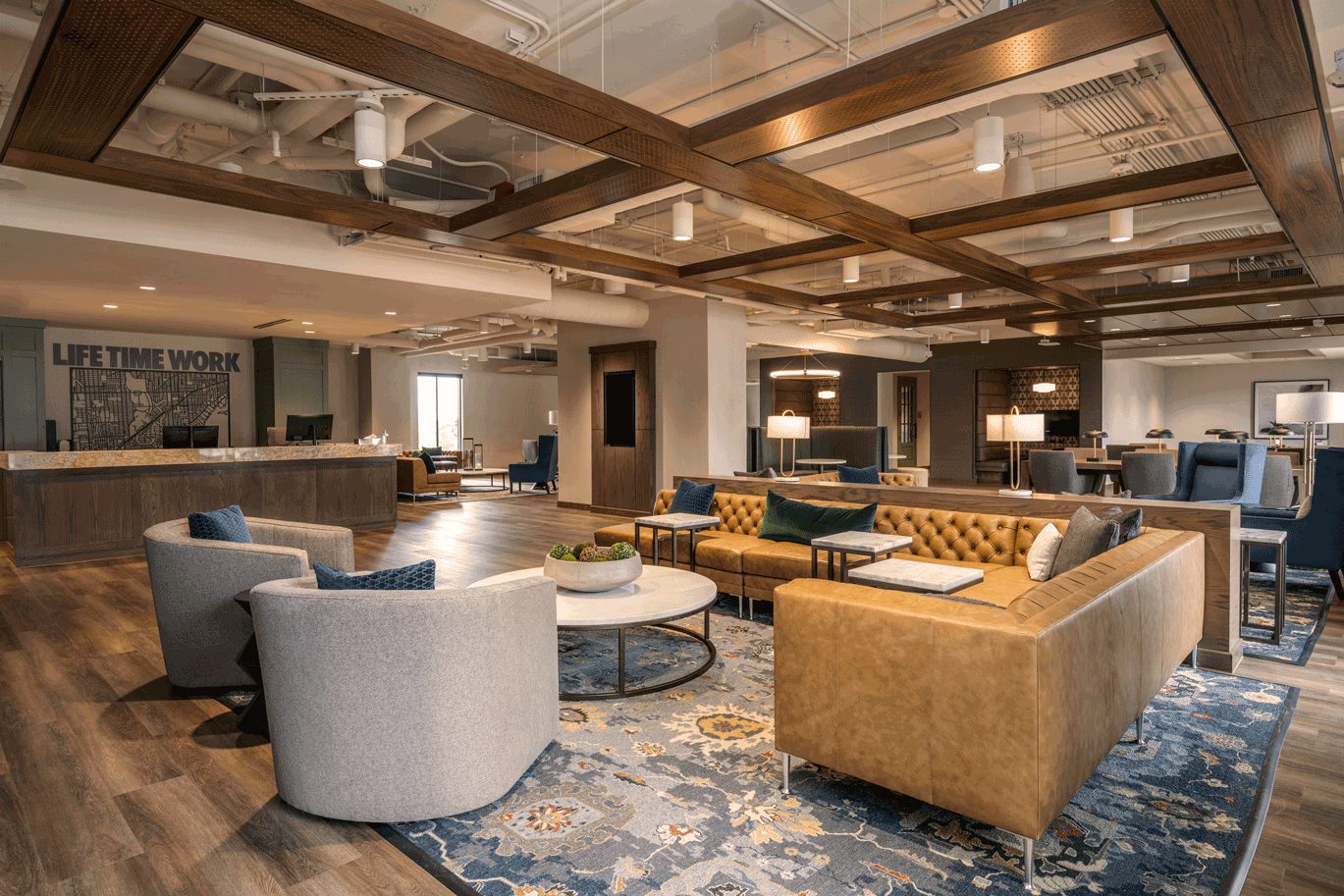 lounge area with chairs and a couch at Life Time Work Lounge