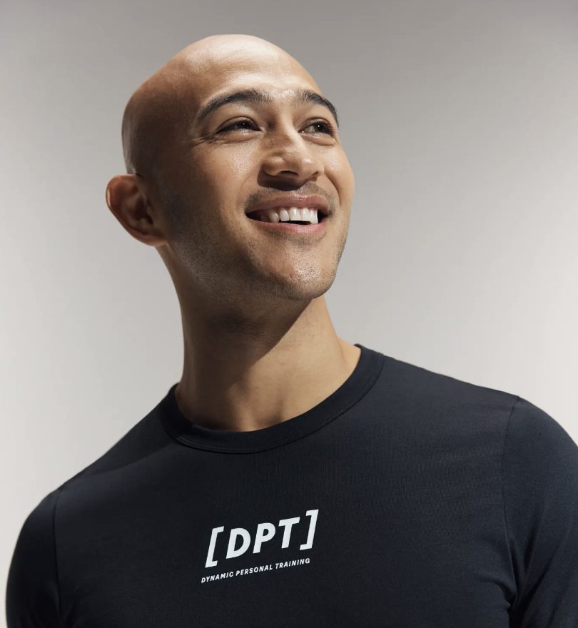 man wearing a black D P T shirt