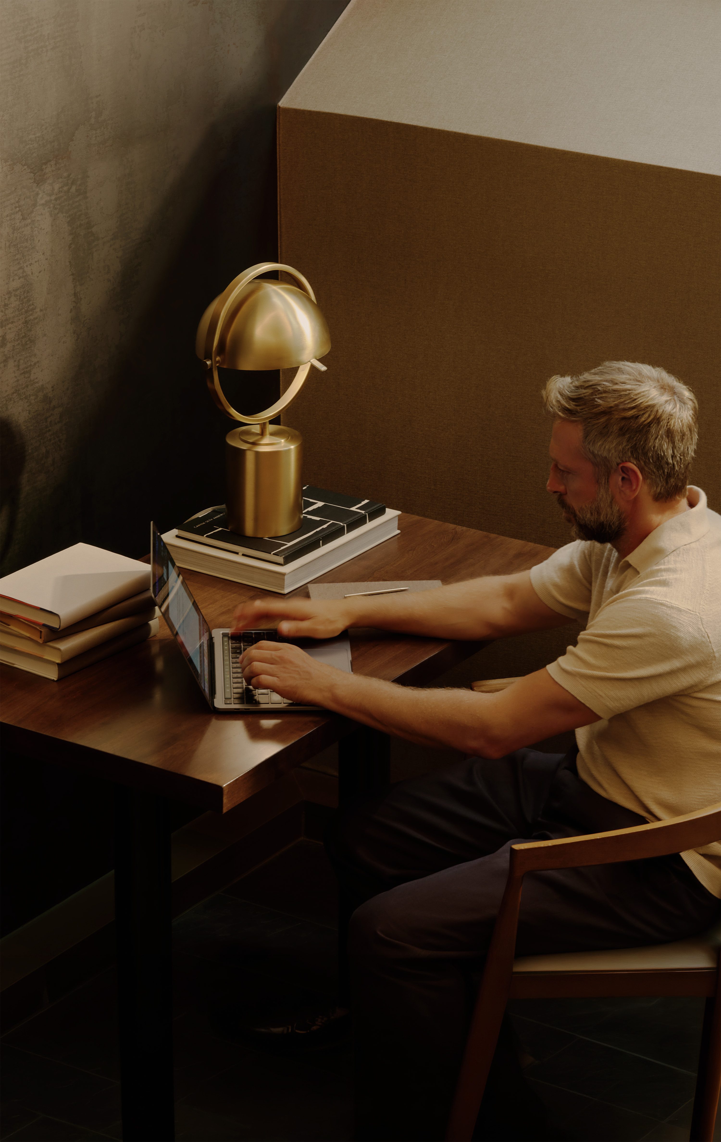 man working on computer at desk