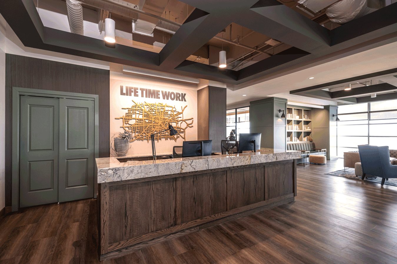 reception desk and a green door off to the side of the desk