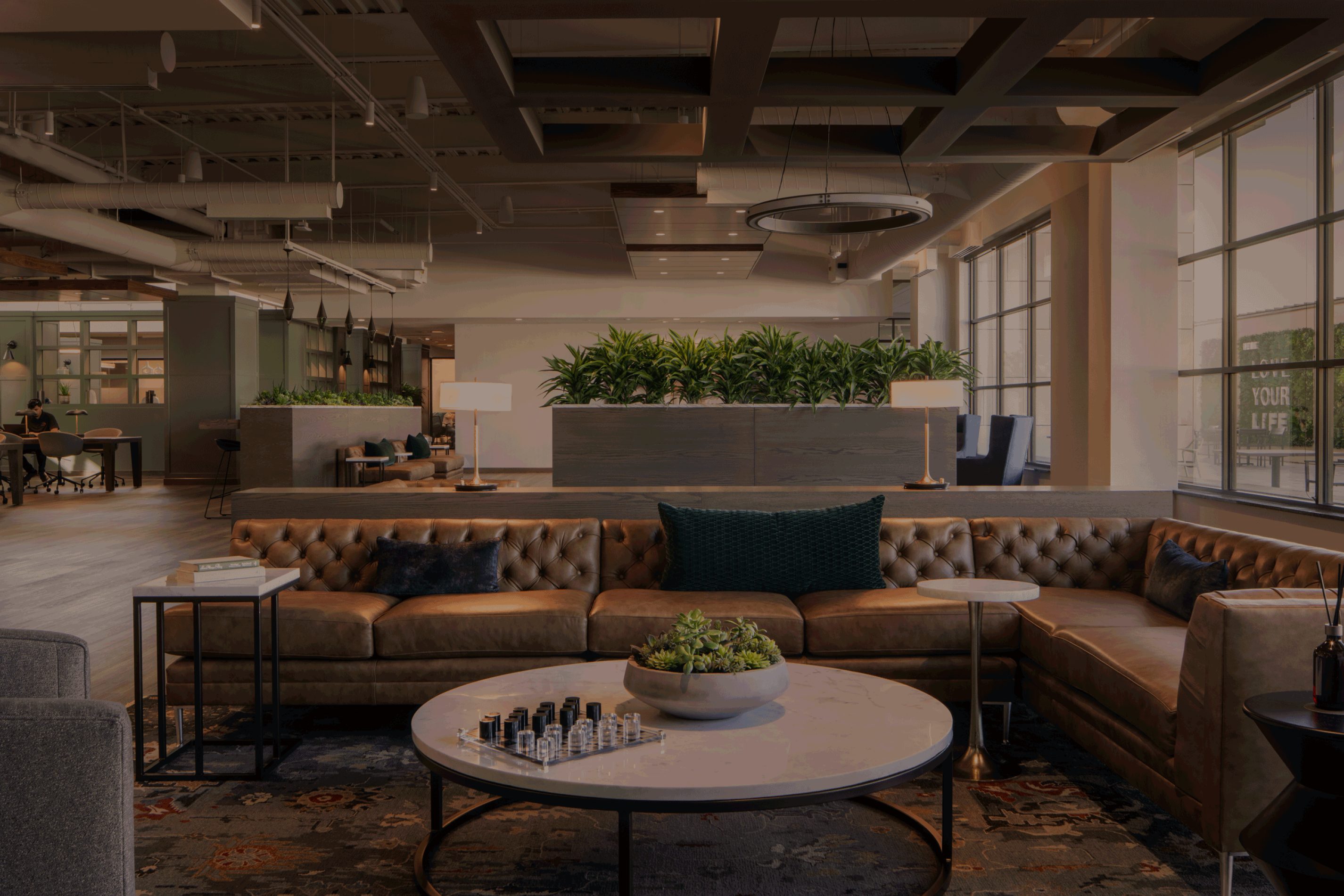 brown leather couch in the Life time Work seating area