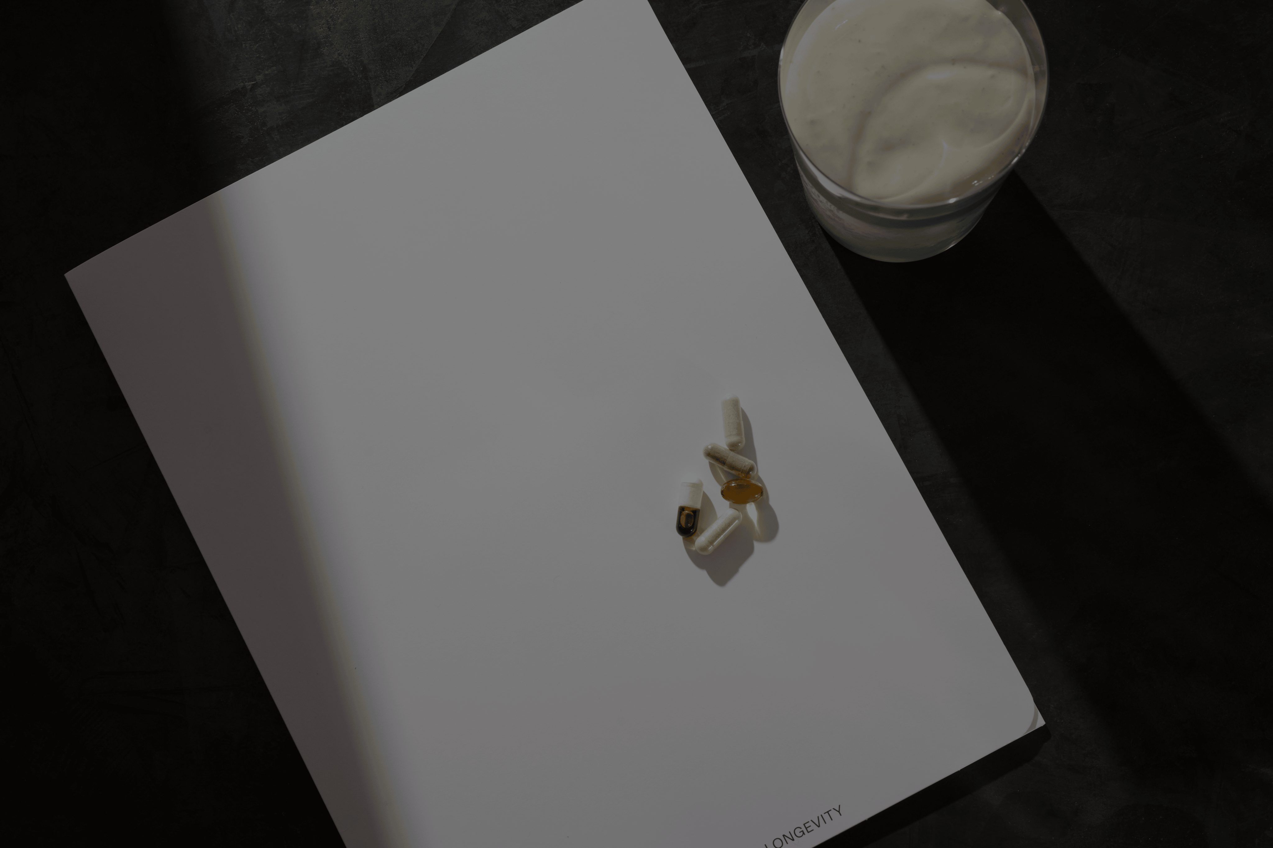 pad of paper with vitamins sitting on top