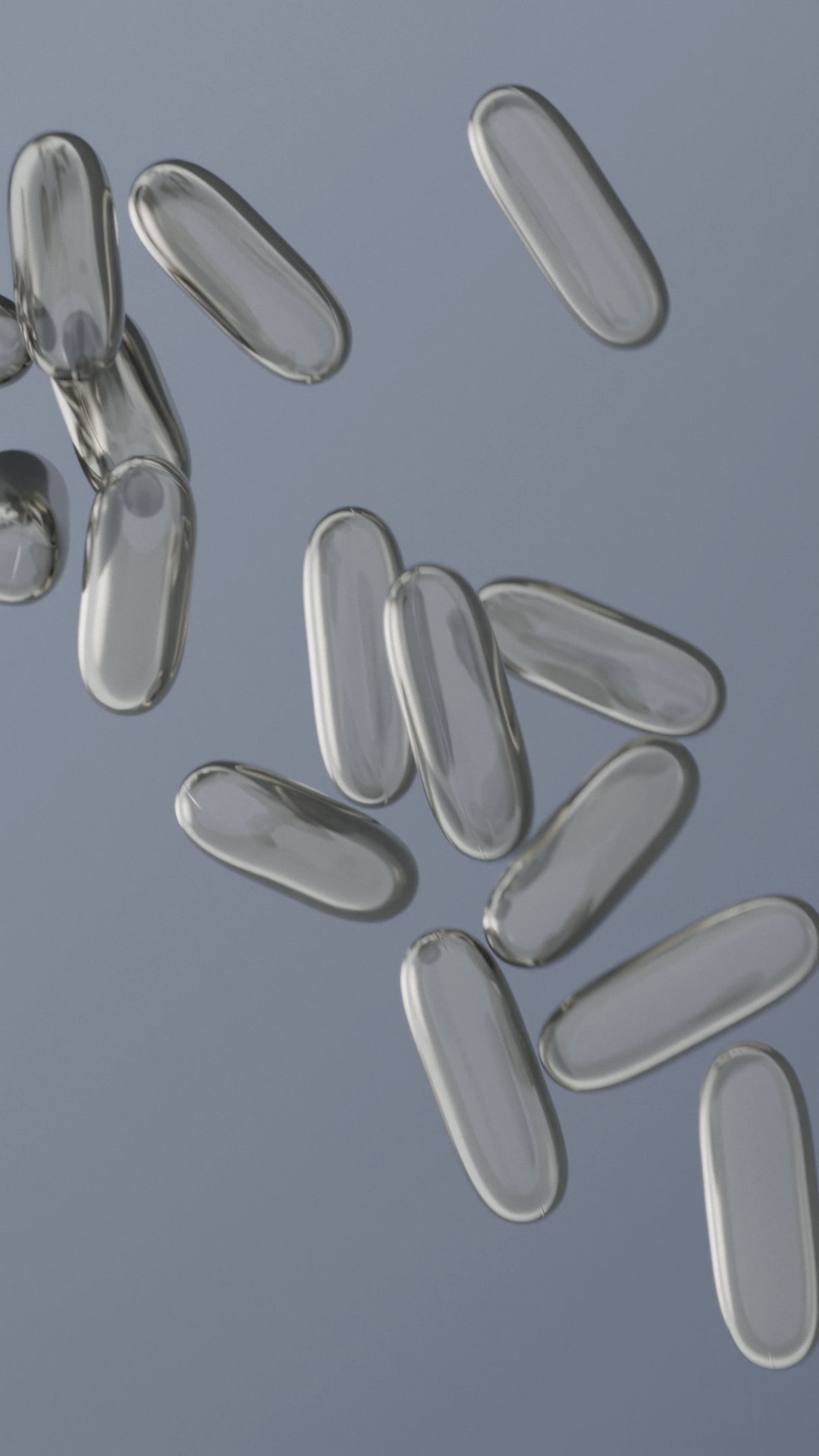 clear pill capsules on a gray background